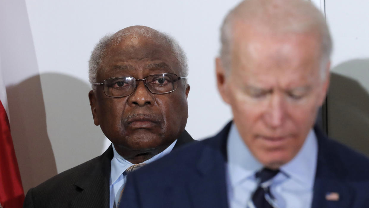 House Majority Whip, Rep. Jim Clyburn, D-S.C., left, listens to the Democratic presidential candidate, former Vice President Joe Biden, at an event in North Charleston, S.C., on Feb. 26, 2020.