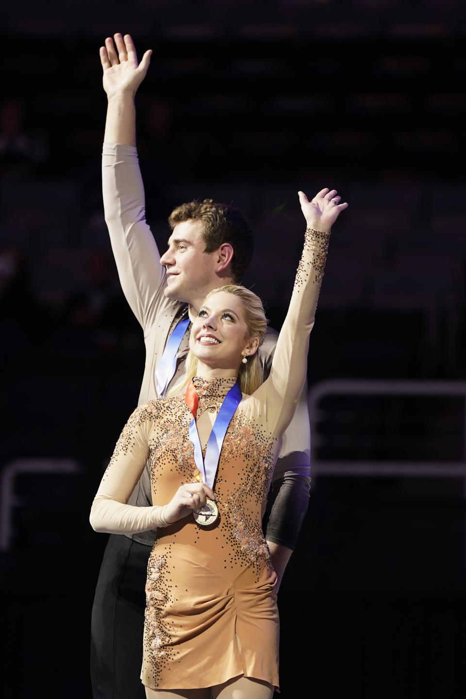 Alexa Knierim, foreground, and Brandon Frazier celebrate after the pairs free skate at the U.S. figure skating championships in San Jose, Calif., Saturday, Jan. 28, 2023. Knierim and Frazier finished first in the event. (AP Photo/Tony Avelar)