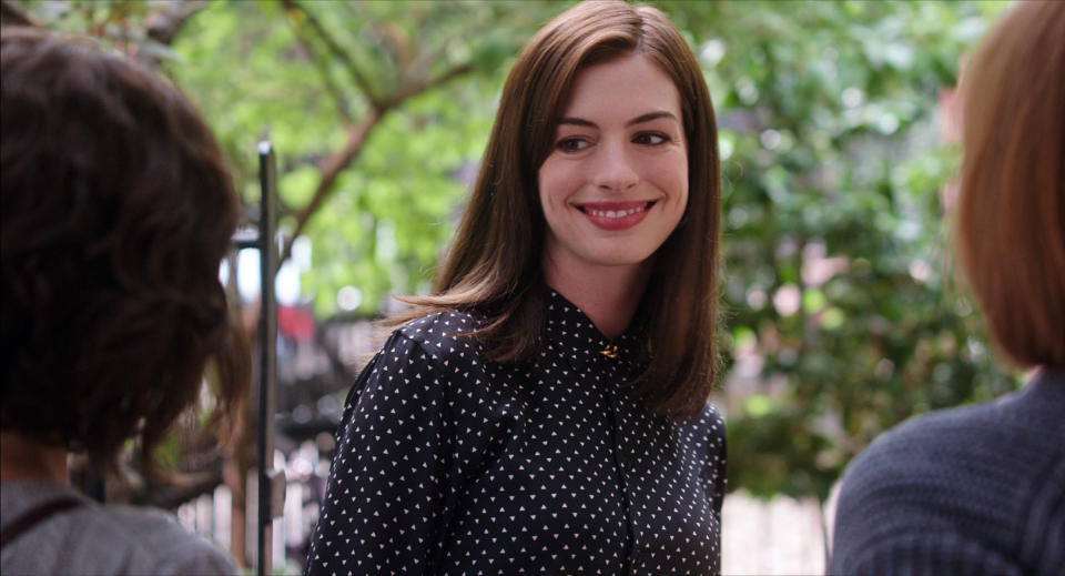 Anne Hathaway as Jules, smiling