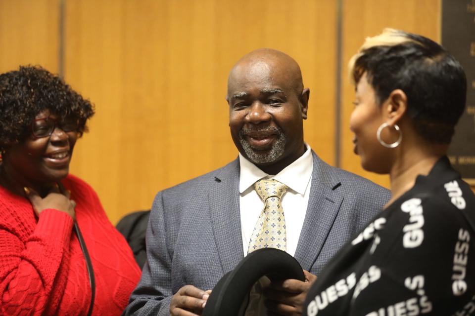 Michael Rhynes chats with his sister, Petronia Rhynes and daughter, Michelle Miller, before heading into court.