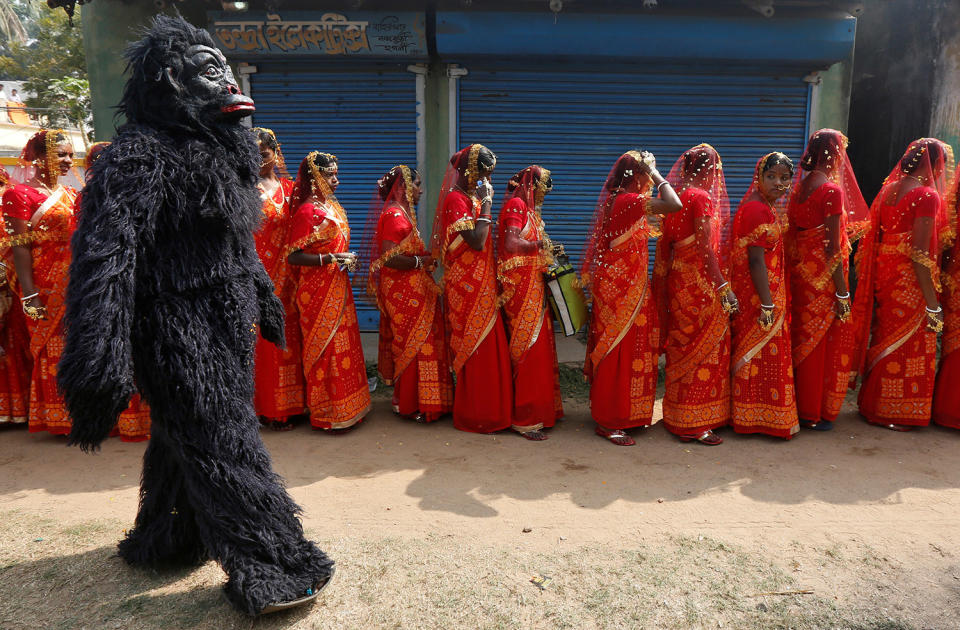 Ape performer at a mass marriage ceremony