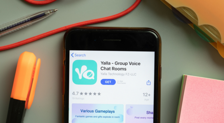 Yalla Group (YALA) Voice Chat Rooms mobile app logo on phone screen close up, Illustrative Editorial.