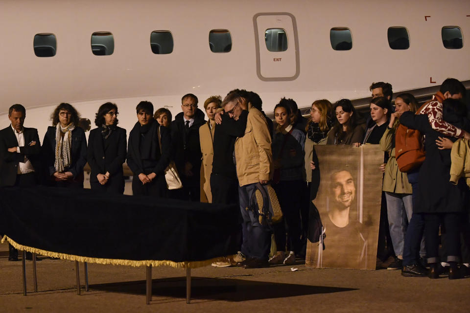 FILE - Relatives send by the coffin of French journalist of BFM TV news channel Frederic Leclerc-Imhoff, who was killed in Ukraine, is carried during a ceremony for the repatriation of his body at Le Bourget Airport, north of Paris, Thursday, June 9, 2022. According to a report released Tuesday, Jan. 24, 2023, by the New York-based Committee to Protect Journalists, killings of journalists around the world jumped by 50% in 2022 compared to the previous year, driven largely by murders of reporters in the three deadliest countries: Ukraine, Mexico and Haiti. (Julien de Rose, Pool via AP, File)