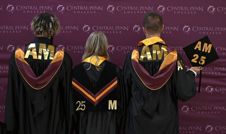 Students honor Central Penn College baseball player Angel Mercado during graduation by wearing his initials and team number on Thursday, May 25, 2023, in Summerdale, Pa. Mercado, 19, an aspiring middle infielder who had just completed his freshman season at Division II Central Penn College, died accidentally when a makeshift dugout collapsed playing in a summer recreation league that held its games and practices in a park in Harrisburg. (Central Penn College via AP)