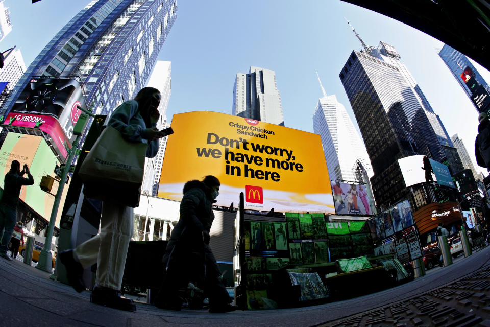 NEW YORK - NEW YORK - APRIL 13: People walk near McDonald's at Times Square on April 13, 2021 in New York. More than 300 corporates including Google and Mc Donalds are pushing the Biden administration to almost double the United States target for cutting the planet warming emissions, ahead global summit on climate change in 2021. (Photo by John Smith/VIEWpress)