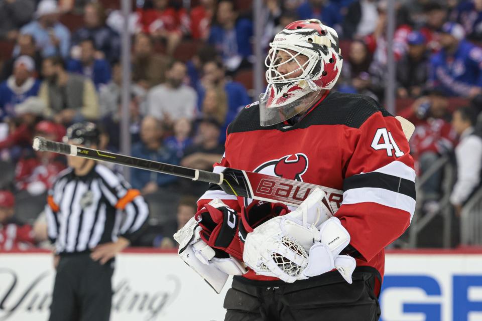 Apr 20, 2023; Newark, New Jersey, USA; New Jersey Devils goaltender Vitek Vanecek (41) holds a teammates gloves during the third period in game two of the first round of the 2023 Stanley Cup Playoffs against the New York Rangers at Prudential Center. Mandatory Credit: Vincent Carchietta-USA TODAY Sports