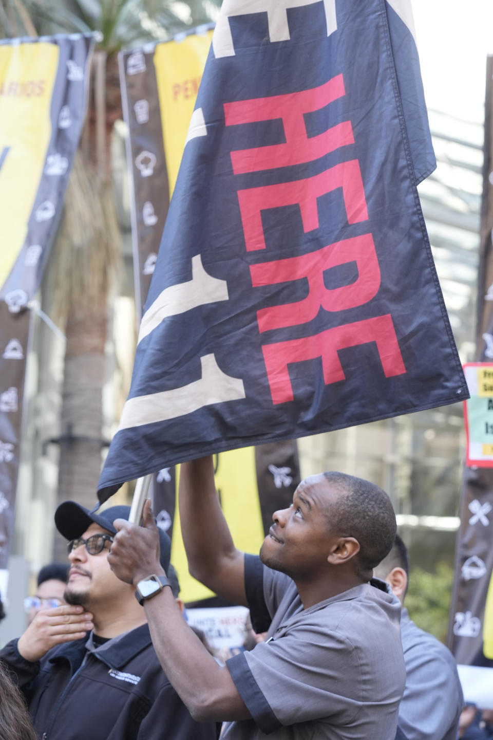 Unite Here Local 11 member, hotel housekeeper Marvin Allen attends a rally on the steps of the Intercontinental Hotel downtown in Los Angeles on Monday, March 25, 2024. Thousands of Southern California hospitality workers ratified a new contract with 34 hotels after repeated strikes since last summer and will keep fighting for deals with more than two dozen others, their union announced Monday. (AP Photo/Damian Dovarganes)