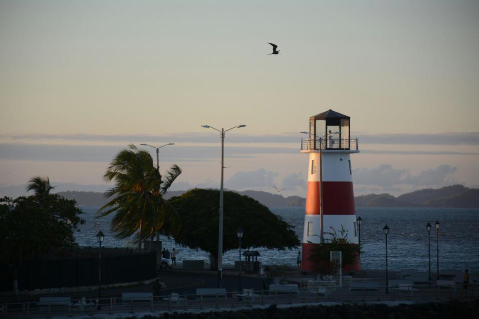 Learn about this historically significant holiday that is popular among Costa Ricans. pictured: a lighthouse in Costa Rica near a town