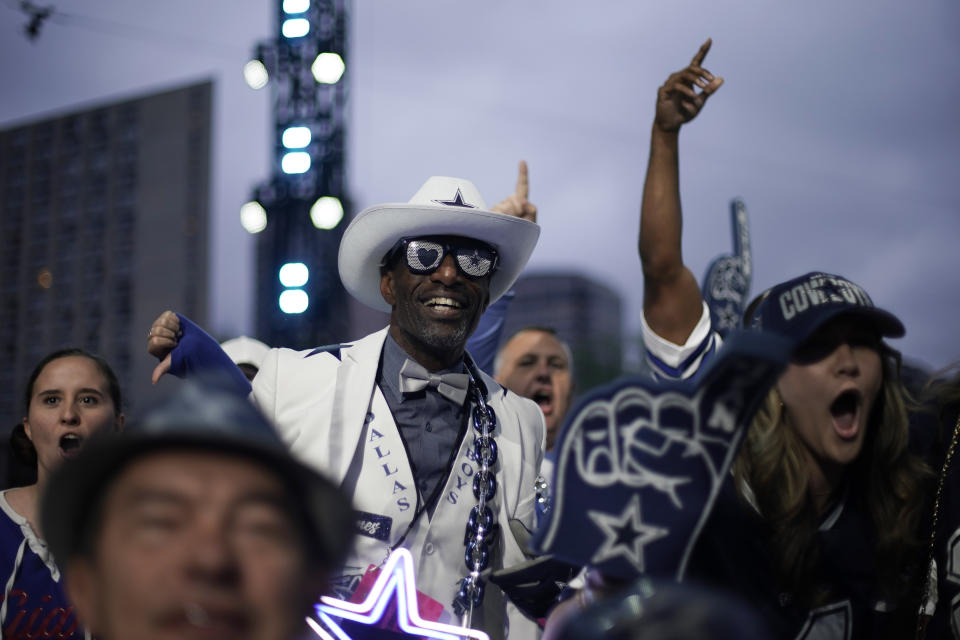 Dallas Cowboys fans cheer during the second round of the NFL football draft, Friday, April 28, 2023, in Kansas City, Mo. (AP Photo/Charlie Riedel)