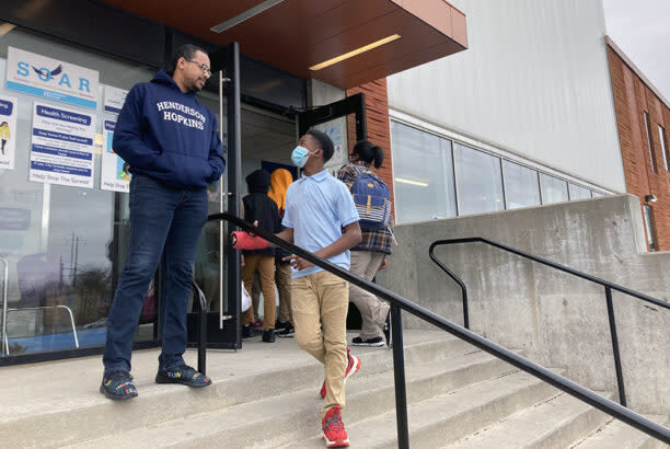 Kyair Butts talks to a student during a midday break from academics at Henderson-Hopkins School (Greg Toppo)