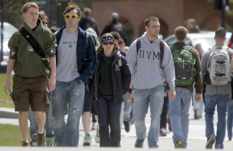 FILE - In this April 30, 2012, file photo, students walk across campus at the University of Vermont in Burlington, Vt. UVM was ranked nineteenth on the best party school list. College students consider the University of Iowa the nation's best party school, even though Iowa City has tried to make its famous bar scene less hospitable to underage drinkers. The Princeton Review bestowed Iowa with the top ranking Monday on a list determined by 126,000 students in a nationwide survey. (AP Photo/Toby Talbot)