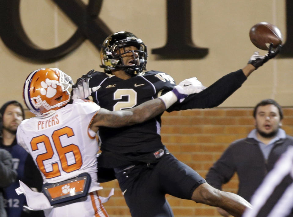 Wake Forest's Matt James (2) misses a catch as Clemson's Garry Peters (26) defends during the second half of an NCAA college football game in Winston-Salem, N.C., Thursday, Nov. 6, 2014. (AP Photo/Chuck Burton)