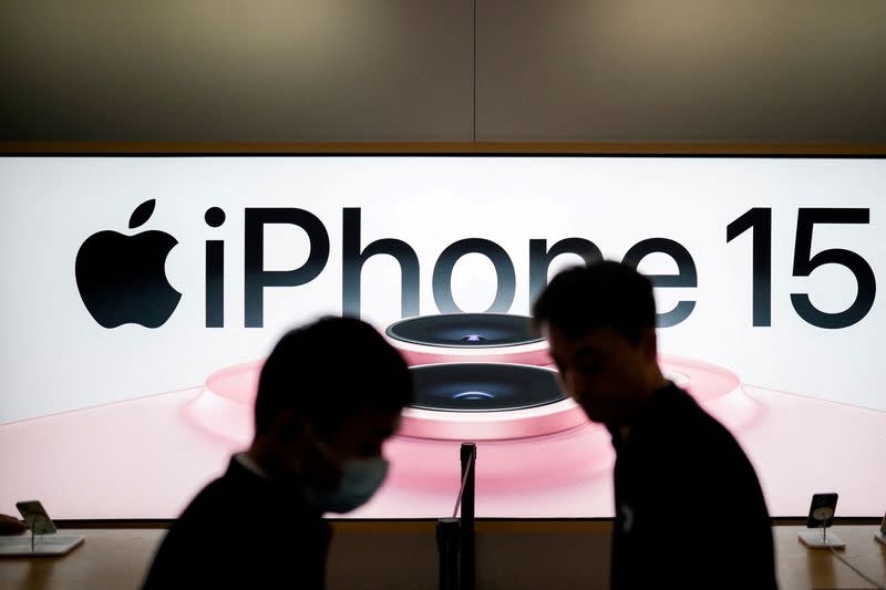 FILE PHOTO: An Apple iPhone 15 advertisement is seen as it officially goes on sale across China at an Apple Store in Shanghai