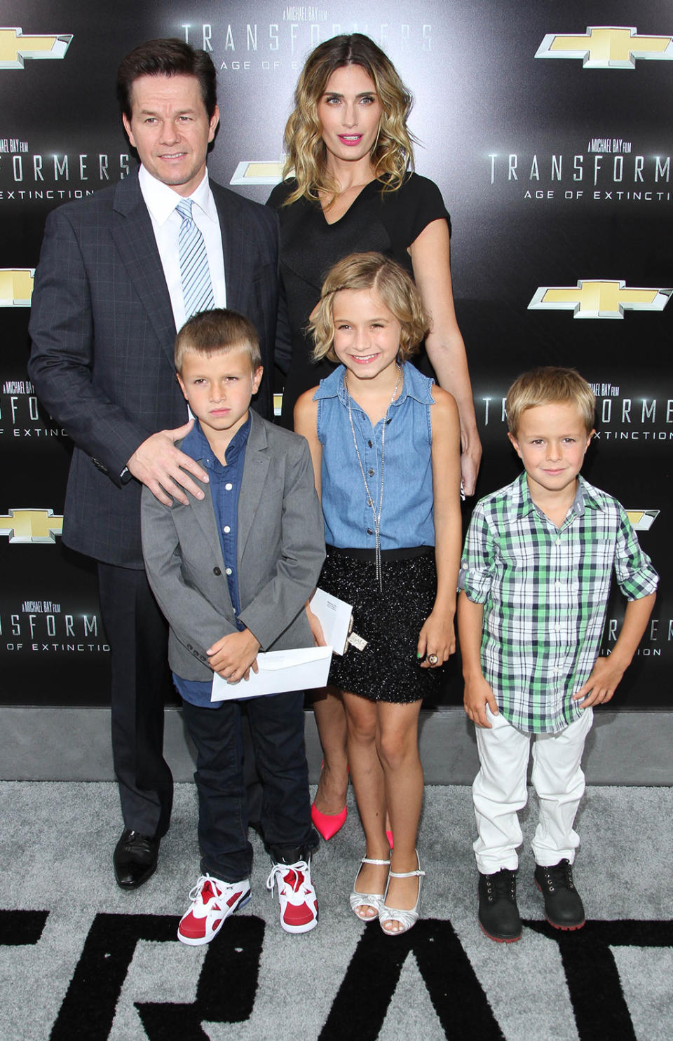 <p>Wahlberg — who replaced LaBeouf as the franchise lead in the fourth installment, <i>Transformers: Age of Extinction</i> — brings wife Rhea Durham and their kids to the New York premiere on June 25, 2014. (Photo: Rob Kim/Getty Images) </p>