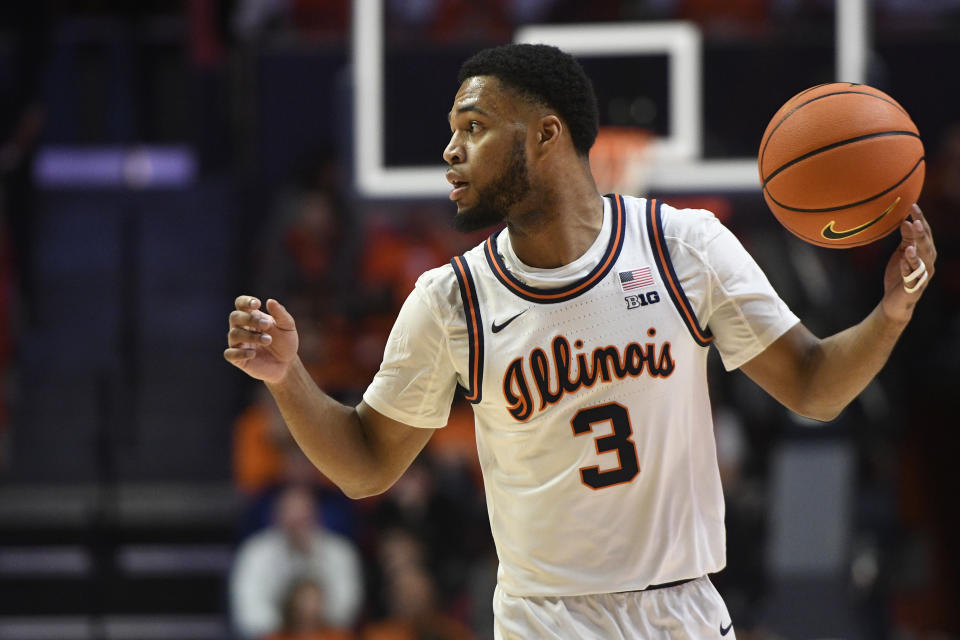 Illinois' Jayden Epps (3) advances the ball during the first half of an NCAA college basketball game against Wisconsin, Saturday, Jan. 7, 2023, in Champaign, Ill. (AP Photo/Michael Allio)