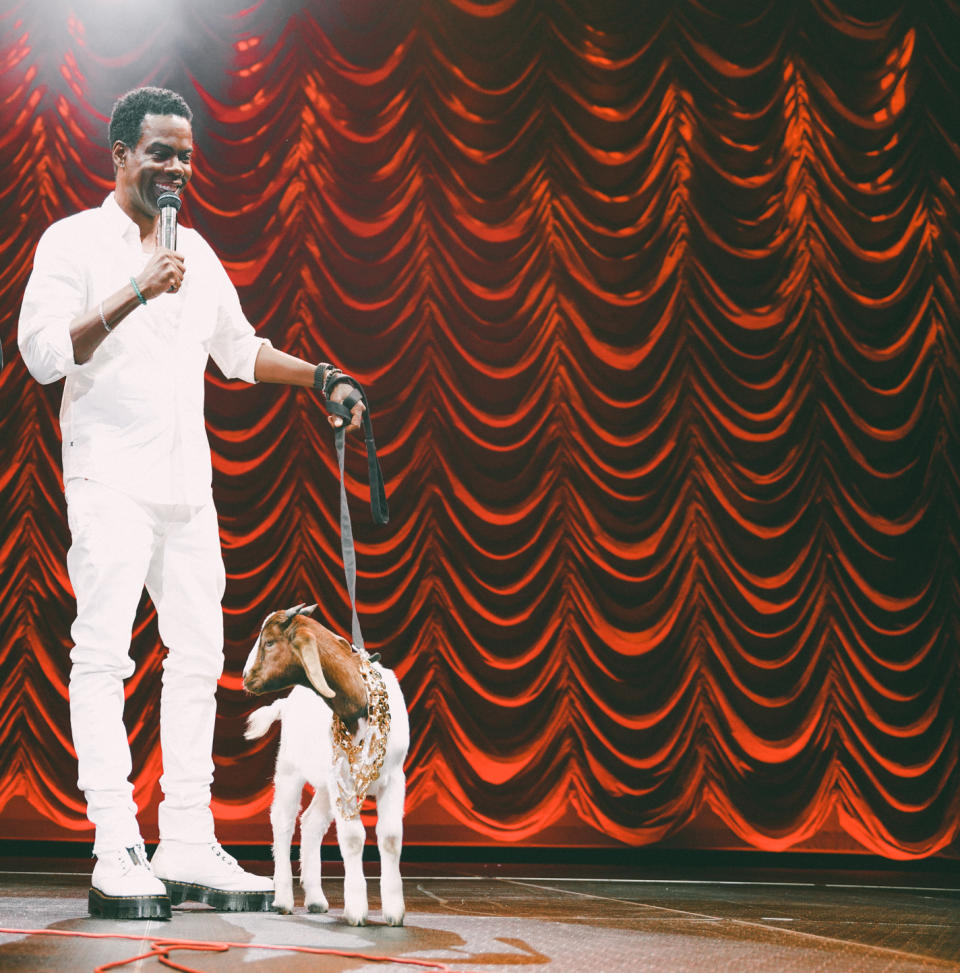 Chris Rock on stage with live goat