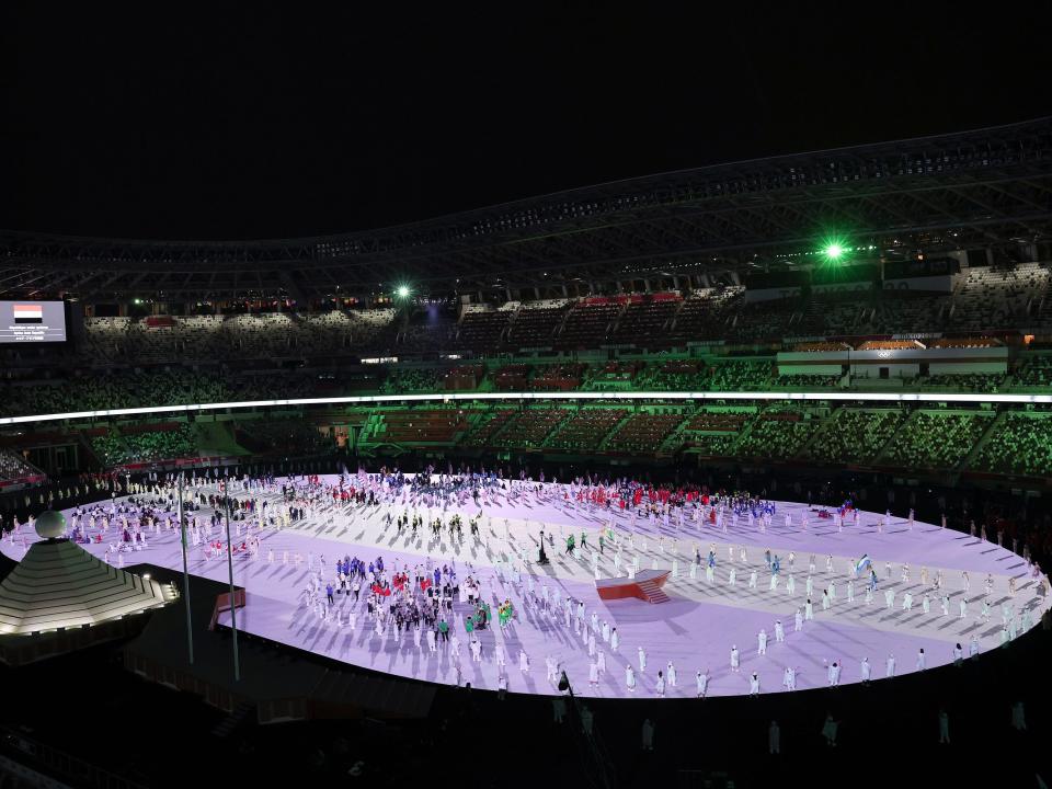 Performers gather during The Tokyo Olympics opening ceremony