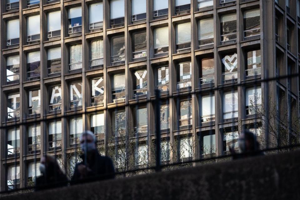 Residents put "Thank You" messages on their windows across the NYU Lounge Hospital to show appreciation to medical staff during the COVID-19 outbreak on April 21, 2020 in New York City.