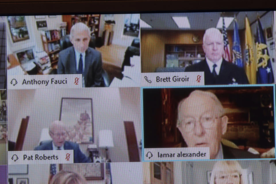 Chairman Lamar Alexander, R-Tenn., shown on a monitor, right, speaks during virtual Senate Committee for Health, Education, Labor, and Pensions hearing, Tuesday, May 12, 2020 on Capitol Hill in Washington. Dr. Anthony Fauci, director of the National Institute of Allergy and Infectious Diseases, top left, is to testify before the committee. (Win McNamee/Pool via AP)