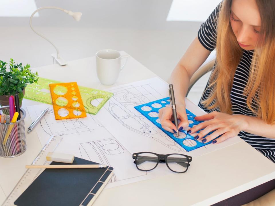 A car designer working on a car design.