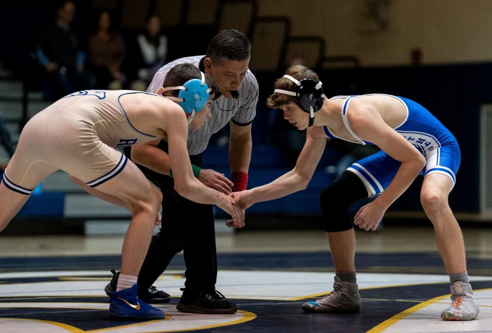 Council Rock South's Connor Lenahan against Quakertown's Julian Moonlight during their 114lbs wrestling match in Holland on Wednesday, Dec. 13, 2023.

Daniella Heminghaus | Bucks County Courier Times