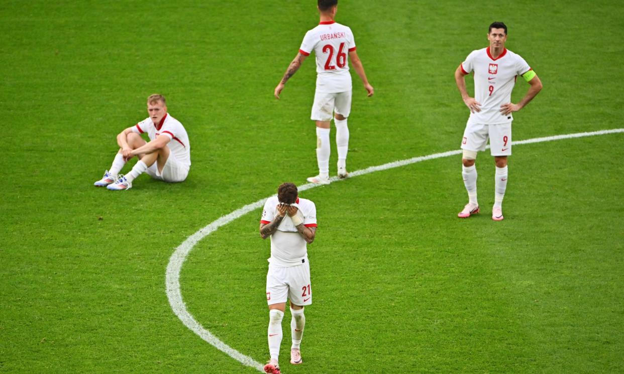 <span>Nicola Zalewski and his teammates looks dejected after Poland's defeat to Austria.</span><span>Photograph: Dan Mullan/Getty Images</span>