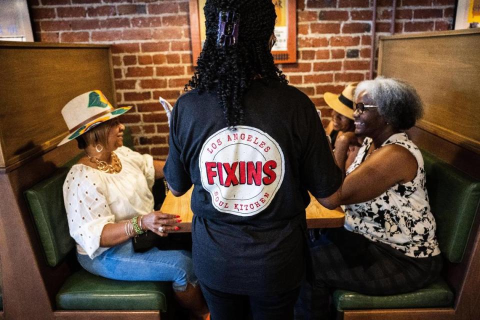 Customers are seated in July at Fixins Soul Kitchen.