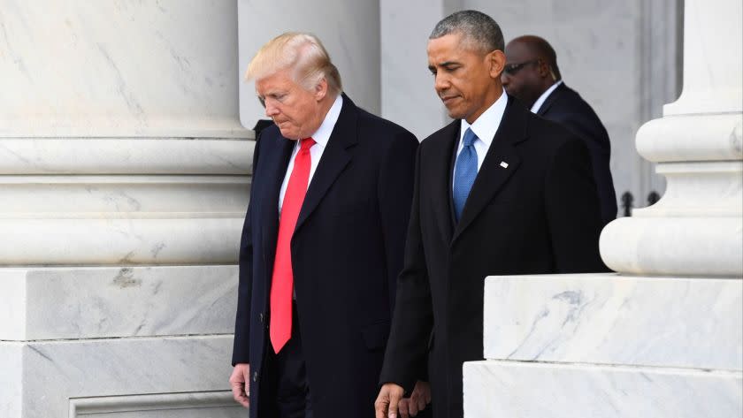 President Trump walks with former President Obama on Capitol Hill in Washington on Jan. 20.