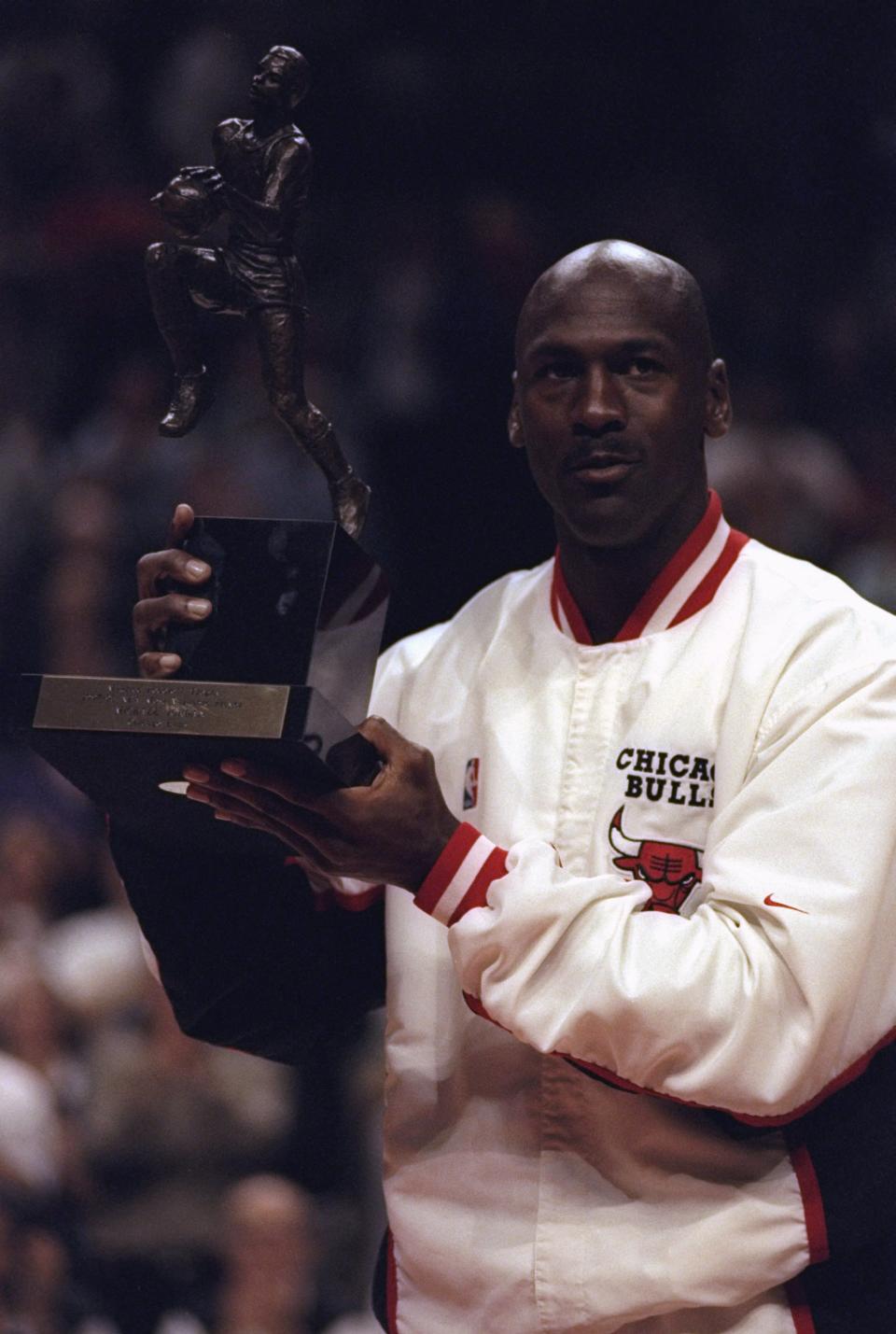 Michael Jordan wins his fifth MVP award in 1998. (Getty Images)