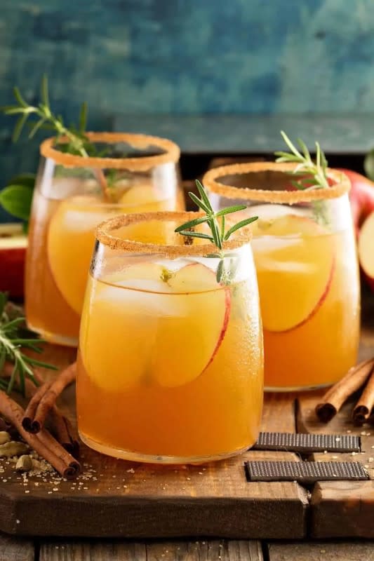 <p>Craving Some Creativity</p><p>Caramel Apple Sangria puts an autumn twist on a party classic and the Hot Toddy is perfect for those of us who celebrate Thanksgiving with cold and snow outside.<br></p><p><strong>Get the recipe: <a href="https://www.cravingsomecreativity.com/caramel-apple-sangria-best-fall/?utm_medium=social&utm_source=pinterest&utm_campaign=tailwind_tribes&utm_content=tribes&utm_term=1146246200_56446240_408230" rel="nofollow noopener" target="_blank" data-ylk="slk:Caramel Apple Sangria;elm:context_link;itc:0;sec:content-canvas" class="link ">Caramel Apple Sangria</a></strong></p>