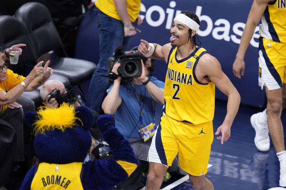 Indiana Pacers guard Andrew Nembhard (2) celebrates after making a basket during the second half against the Milwaukee Bucks in Game 6 in an NBA basketball first-round playoff series, Thursday, May 2, 2024, in Indianapolis. (AP Photo/Michael Conroy)