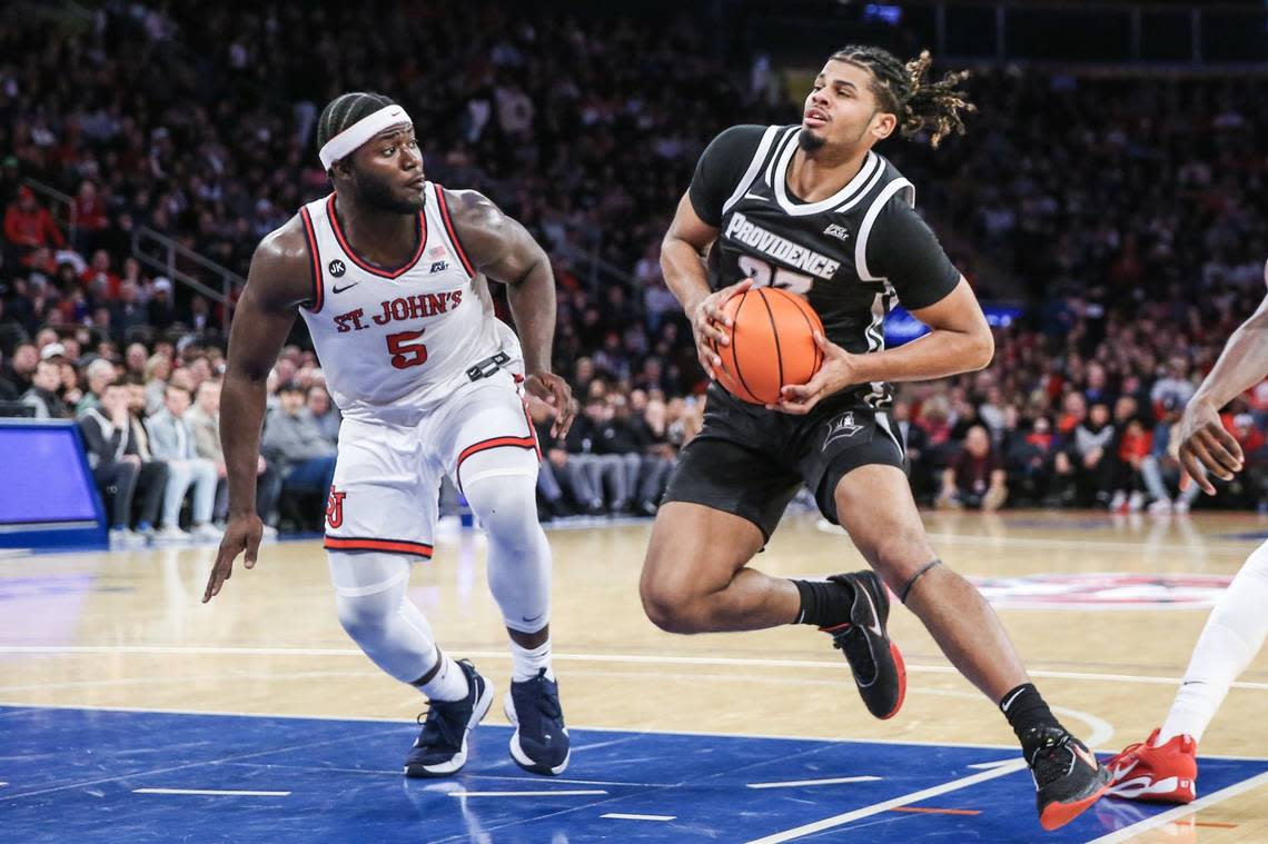 Providence forward Bryce Hopkins, right, is guarded by St. John’s guard Dylan Addae-Wusu at Madison Square Garden. in New York on Feb. 11.