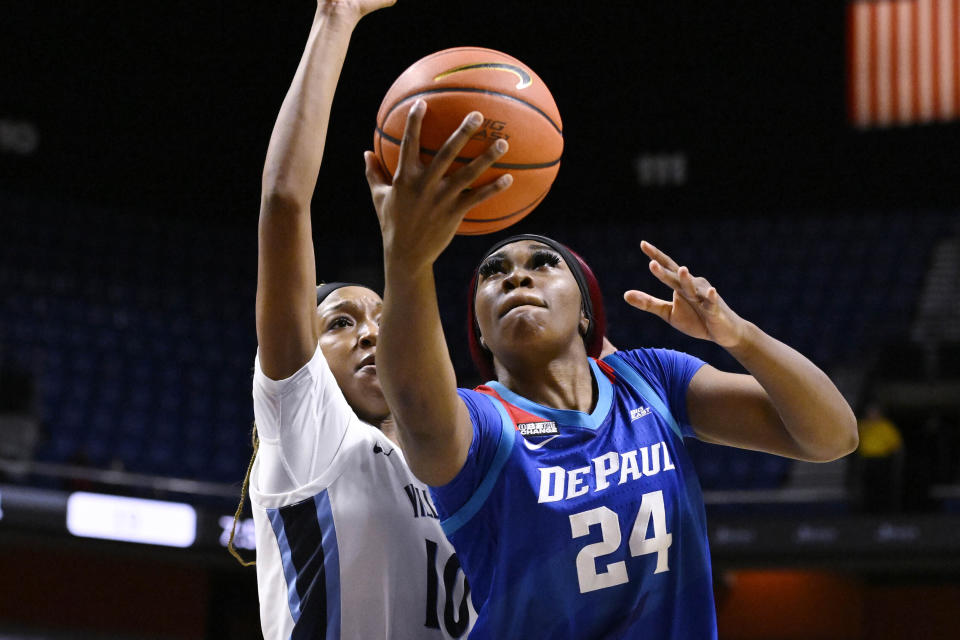 FILE - Then-DePaul's Aneesah Morrow (24) shoots as Villanova's Christina Dalce (10) defends during the first half of an NCAA college basketball game in the quarterfinals of the Big East Conference tournament at Mohegan Sun Arena, Saturday, March 4, 2023, in Uncasville, Conn. LSU is ranked No. 1 in the AP Top 25 preseason women's basketball poll, released Tuesday, Oct. 17, 2023. There's clearly a lot of optimism around LSU as they return a stellar group, including Angel Reese and added two huge transfers with Hailey Van Lith and Aneesah Morrow. (AP Photo/Jessica Hill, File)
