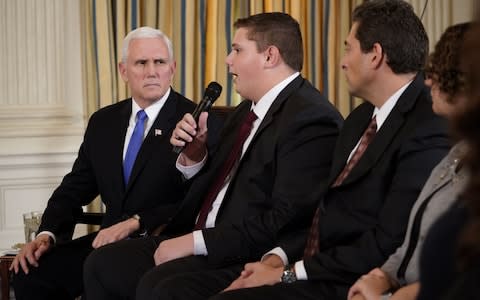 US Vice President Mike Pence takes part in a listening session on gun violence with teachers and students - Credit: AFP/MANDEL NGAN