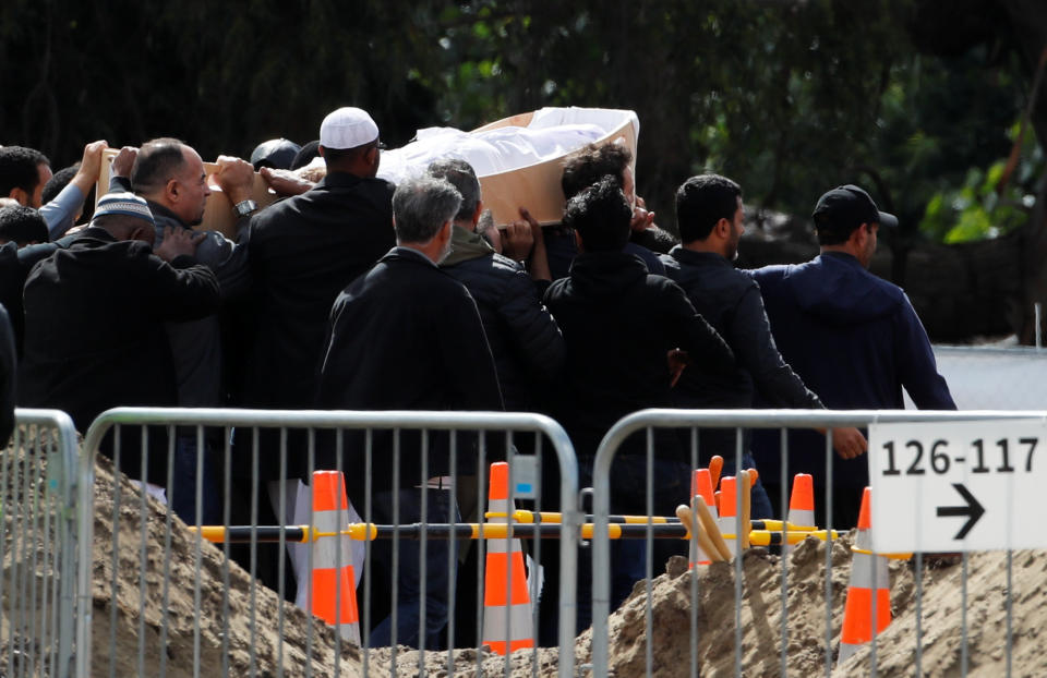 The body of a victim of the mosque attacks is carried during the burial ceremony at the Memorial Park Cemetery in Christchurch. Source: Reuters/Jorge Silva