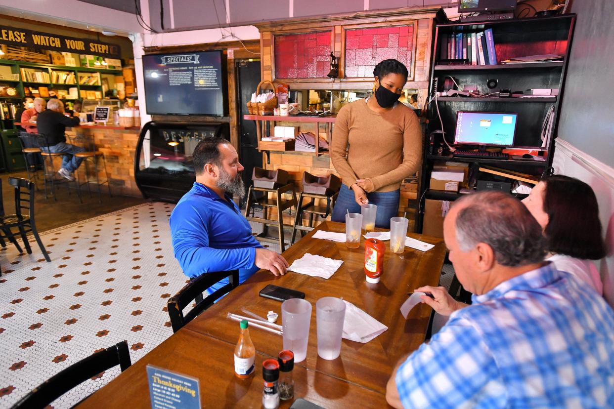 Laurie Jarvis, co-owner of Cool Moose Cafe on Park Street, talks with customers Wednesday morning at the popular Riverside neighborhood breakfast and lunch restaurant.