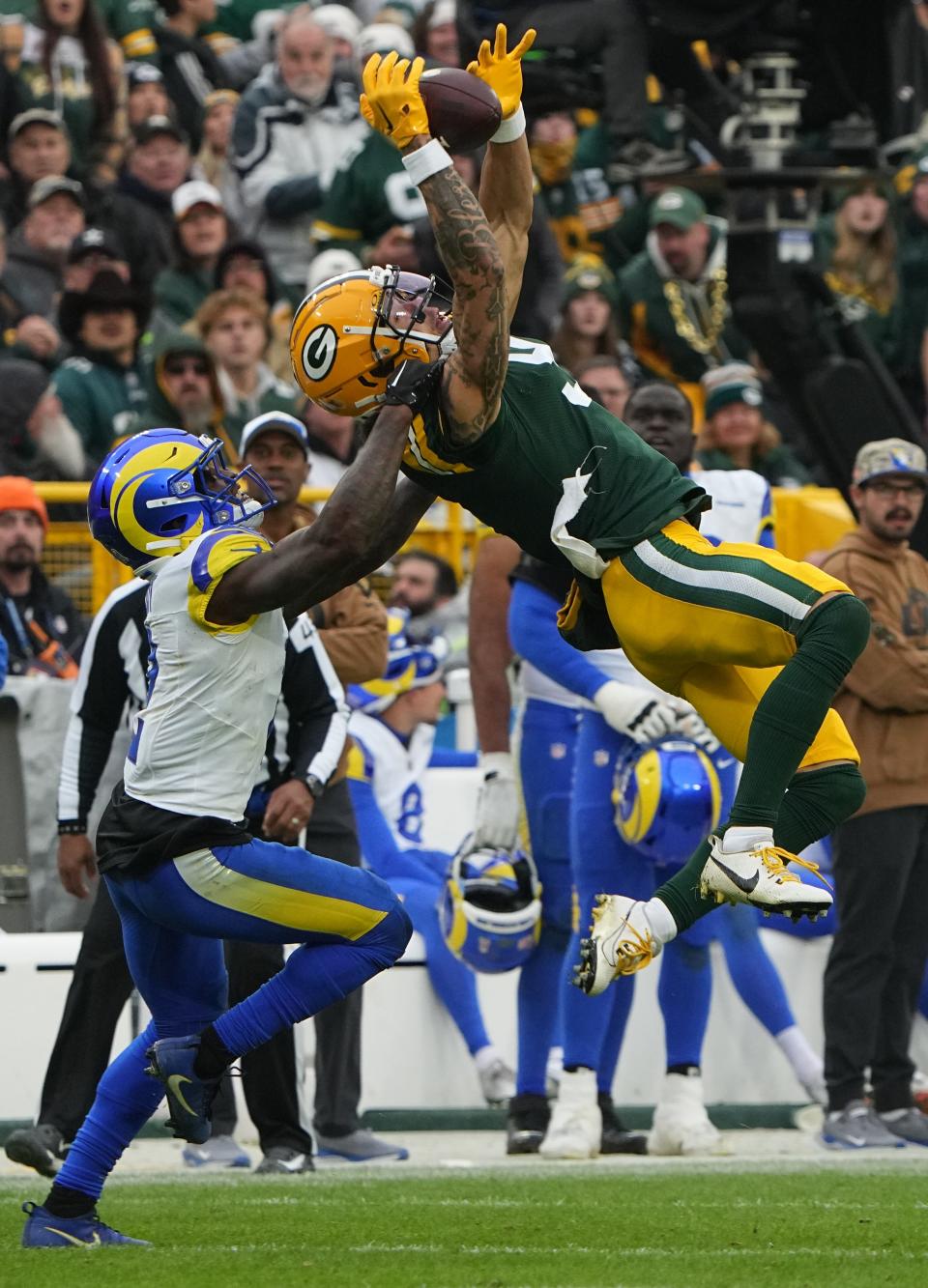 Green Bay Packers wide receiver Christian Watson (9) reels in a 37-yard pass during the third quarter of their 20-3 victory at Lambeau Field on Nov. 5.