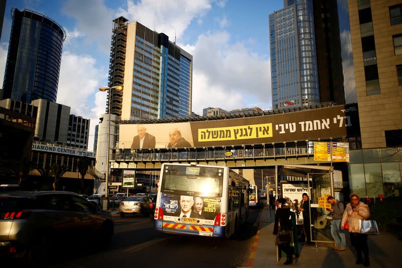 Israeli Prime Minister Benjamin Netanyahu's Likud party election campaign banner depicting his main rival Benny Gantz, head of Blue and White party sitting with Arab politician Ahmad Tibi, of the Joint List party, in Ramat Gan