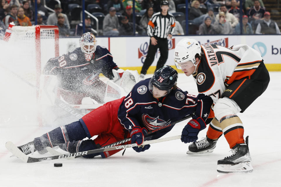 Anaheim Ducks' Frank Vatrano, right, and Columbus Blue Jackets' Damon Severson vie for the puck during the third period of an NHL hockey game Tuesday, Oct. 24, 2023, in Columbus, Ohio. (AP Photo/Jay LaPrete)