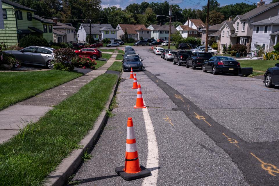 Aug 18, 2023; Clifton, New Jersey, USA; Traffic cones are set up on Dwight Terrace near the intersection of Pershing Road. Mandatory Credit: Anne-Marie Caruso-The Bergen Record