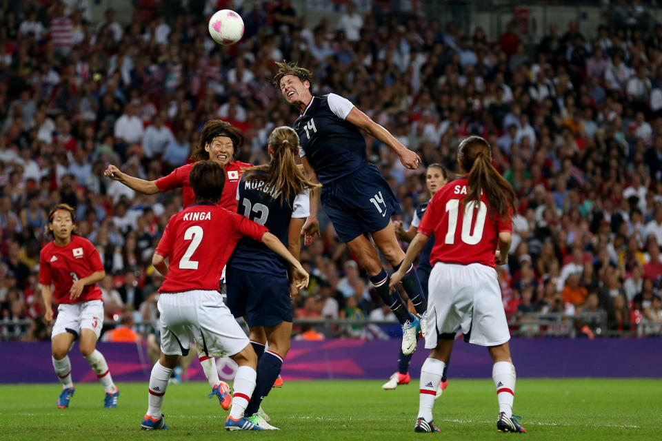 LONDON, ENGLAND - AUGUST 09: Abby Wambach #14 of the United States goes up for a header against Saki Kumagai #4 of Japan during the Women's Football gold medal match on Day 13 of the London 2012 Olympic Games at Wembley Stadium on August 9, 2012 in London, England. (Photo by Julian Finney/Getty Images)