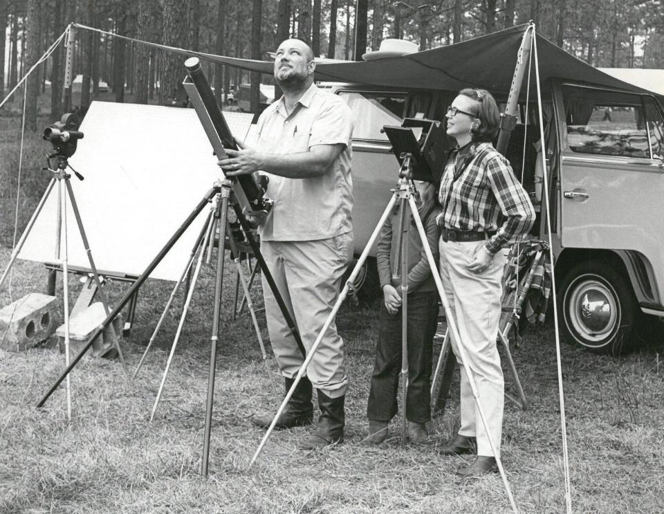On March 7, 1970, Mr. and Mrs. Walter Lang Jr. of Bryan, Texas, and their daughter Pamela, are poised to capture the eclipse on film at Perry, but it was a futile wait. A heavy overcast kept the sky spectacular under wraps, and many other astronomy fans didn't even bother to man their telescopes. (Foster Marshall/Times-Union archive) 