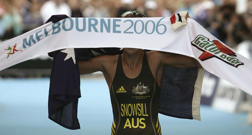 FILE - Australian Emma Snowsill celebrates as she crossed the finish line to win the women's triathlon at the Commonwealth Games in Melbourne, Australia on March 18, 2006. Australia's Victoria state Premier Daniel Andrews on Tuesday, July 18, 2023, said his government has withdrawn as host of the 2026 Commonwealth Games because of a massive increase in the projected cost of staging the multi-sports event. (AP Photo/Rick Rycroft, File)