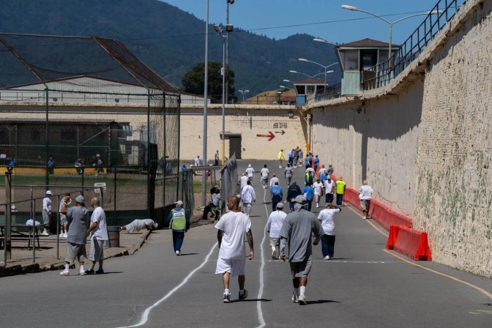 Inmates exercise outside in the yard at San Quentin State Prison in July 2023. Prisoners in solitary confinement are not permitted to have this freedom of movement or contact with others.