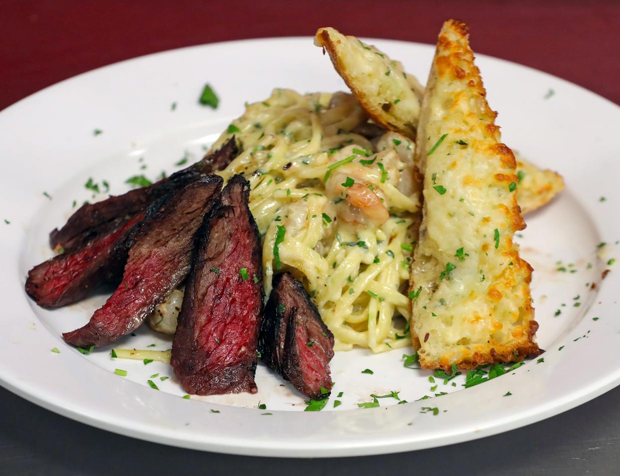 The Eye Opener's linguine and garlic cream served with steak, Wednesday, April 24, 2024, in Akron, Ohio.