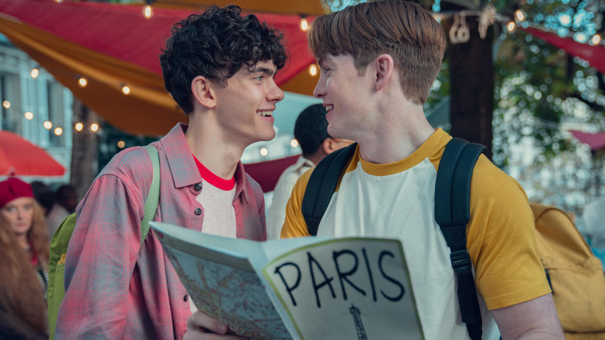  Charlie and Nick smile and look at one another in Heartstopper season 2 