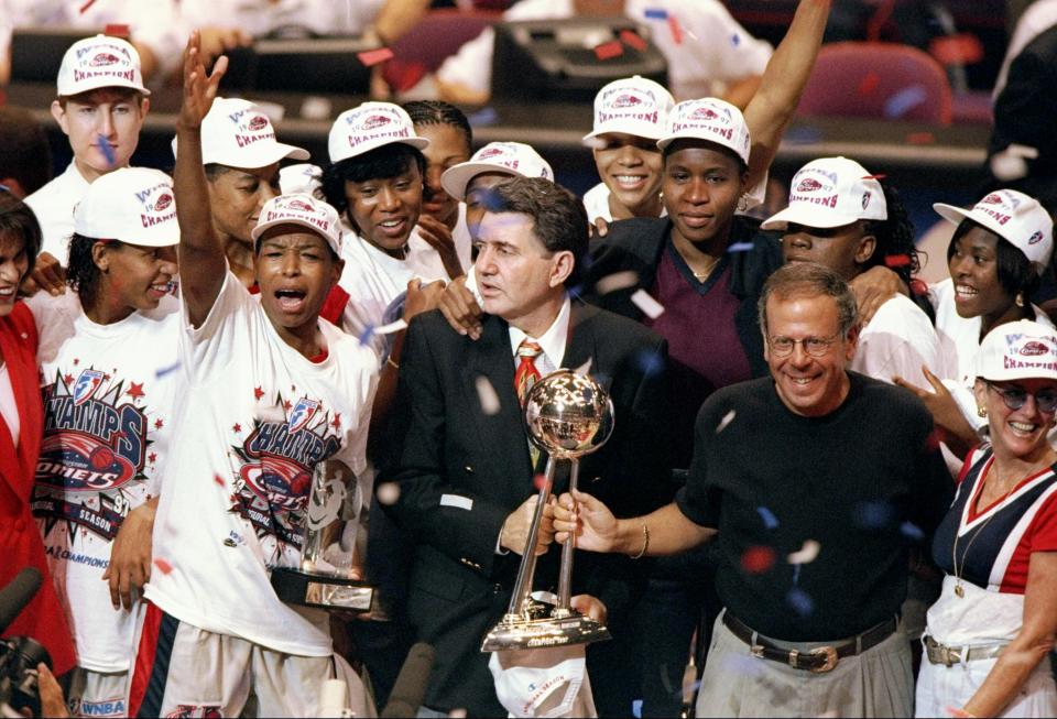 The Houston Comets celebrate after winning the WNBA championship in the league's inaugural season. The Comets won the first four titles in league history. (Todd Warshaw/Allsport, File)