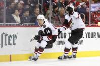 Nov 11, 2018; Washington, DC, USA; Arizona Coyotes right wing Richard Panik (14) celebrates with Arizona Coyotes right wing Christian Fischer (36) after scoring a goal during the second period against the Washington Capitals at Capital One Arena. Amber Searls-USA TODAY Sports