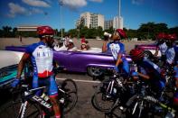 The Wider Image: Haiti's cyclists brave protests and poor roads in race for gold