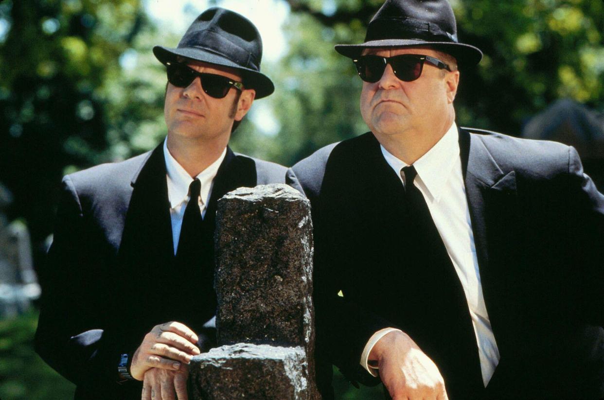 Dan Aykroyd & John Goodman Film: Blues Brothers 2000 (1998) Characters: Elwood Blues & Mighty Mack McTeer  Director: John Landis 06 February 1998   **WARNING** This Photograph is for editorial use only and is the copyright of UNIVERSAL PICTURES and/or the Photographer assigned by the Film or Production Company and can only be reproduced by publications in conjunction with the promotion of the above Film. A Mandatory Credit To UNIVERSAL PICTURES is required. The Photographer should also be credited when known. No commercial use can be granted without written authority from the Film Company.